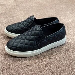 Madden Girl Quilted Slip-On Sneakers in Black and White